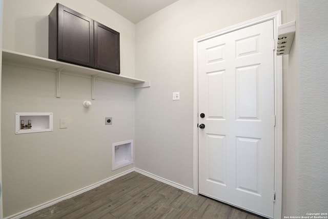 laundry area featuring electric dryer hookup, dark wood-style floors, baseboards, cabinet space, and hookup for a washing machine