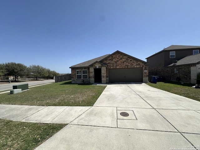 view of front of home with fence, an attached garage, driveway, a front lawn, and brick siding