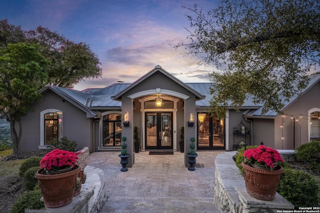2471 Village Oak, Canyon Lake, TX 78133 - view of front of property featuring french doors, a standing seam roof, stucco siding, and metal roof