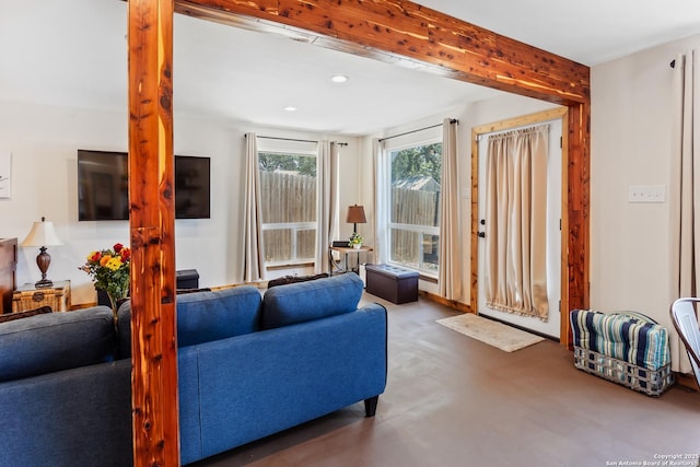 living area featuring concrete floors and recessed lighting