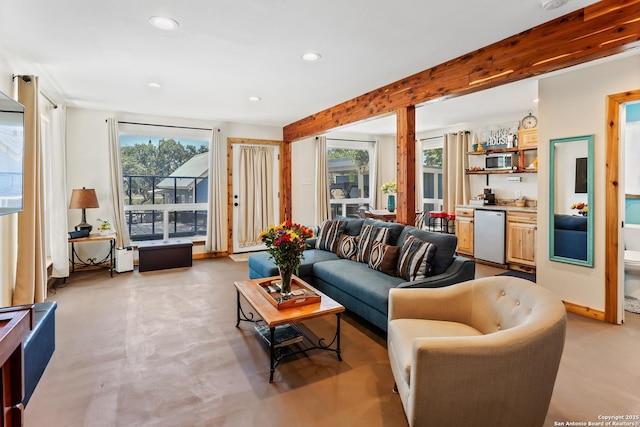 living room featuring beamed ceiling and recessed lighting