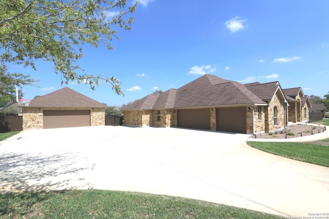 view of front of property with a garage, concrete driveway, and brick siding
