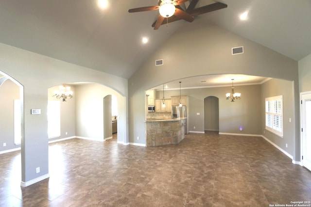 unfurnished living room featuring arched walkways, high vaulted ceiling, visible vents, and ceiling fan with notable chandelier