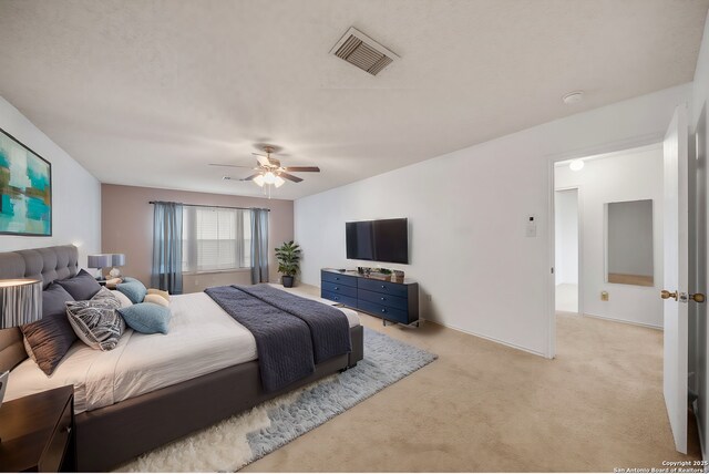 9911 Alexa Pl, San Antonio, TX 78251 - bedroom with ceiling fan, visible vents, and light colored carpet