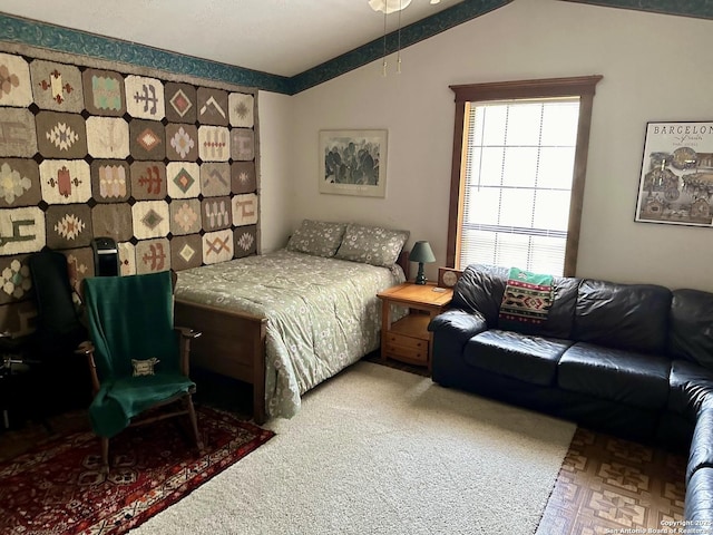 bedroom with lofted ceiling