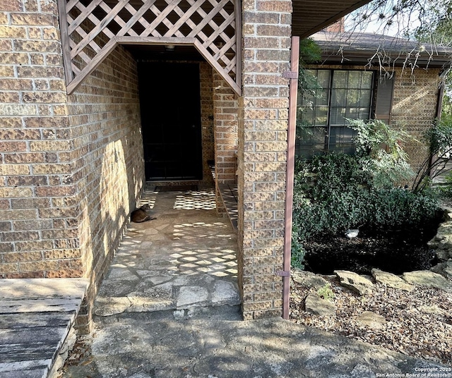 entrance to property with brick siding