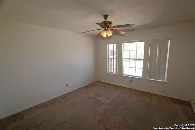 carpeted empty room featuring baseboards, a textured ceiling, a baseboard heating unit, and a ceiling fan