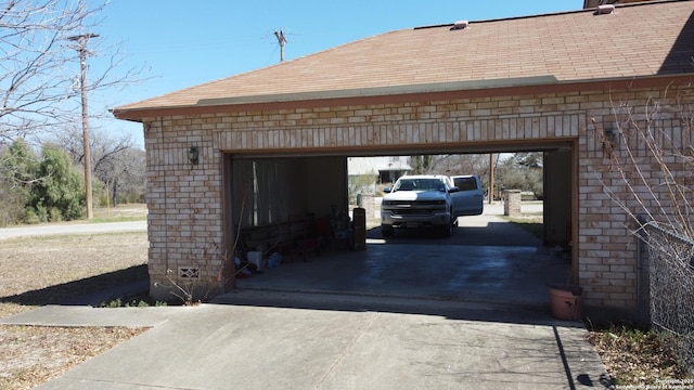 garage with concrete driveway