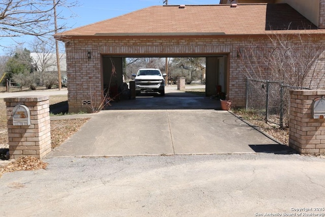 garage featuring driveway