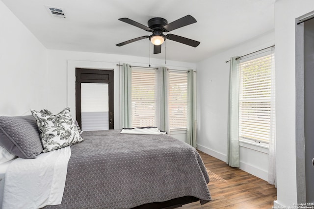 314 Trail, San Antonio, TX 78212 - bedroom with a ceiling fan, wood finished floors, baseboards, and visible vents