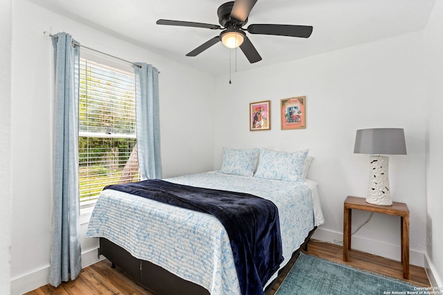 314 Trail, San Antonio, TX 78212 - bedroom with baseboards, ceiling fan, and wood finished floors
