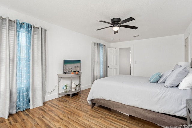 314 Trail, San Antonio, TX 78212 - bedroom featuring visible vents, wood finished floors, and a ceiling fan