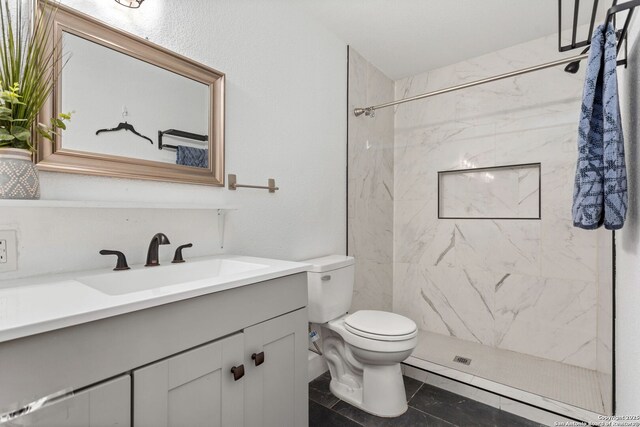 314 Trail, San Antonio, TX 78212 - bathroom featuring toilet, vanity, and a marble finish shower