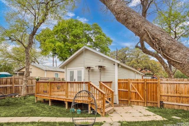 314 Trail, San Antonio, TX 78212 - back of property featuring a fenced backyard, a wooden deck, french doors, and a yard
