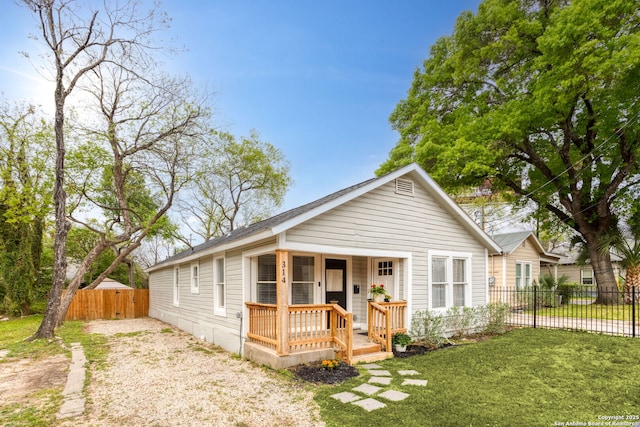 314 Trail, San Antonio, TX 78212 - bungalow-style home featuring a front yard, covered porch, and fence