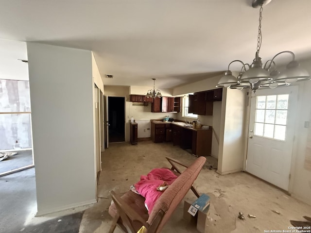 5119 Village Ct, San Antonio, TX 78218 - kitchen featuring a wealth of natural light, visible vents, dark brown cabinets, and a notable chandelier
