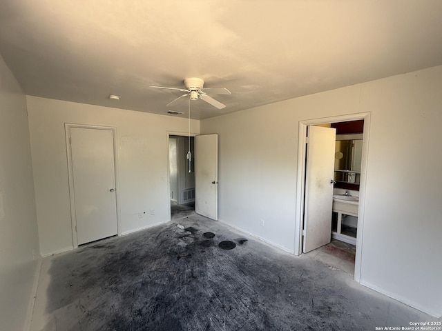 5119 Village Ct, San Antonio, TX 78218 - unfurnished bedroom with concrete floors and a ceiling fan