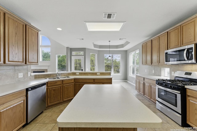 kitchen with light tile patterned floors, visible vents, decorative backsplash, and appliances with stainless steel finishes