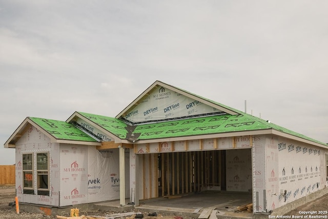 unfinished property with a garage