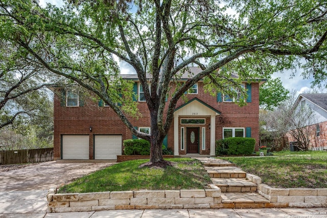 2312 Encino Xing, San Antonio, TX 78259 - view of front facade featuring driveway, an attached garage, fence, and brick siding