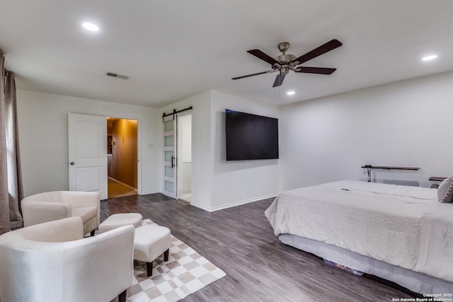 2312 Encino Xing, San Antonio, TX 78259 - bedroom featuring recessed lighting, dark wood-style flooring, baseboards, a barn door, and visible vents