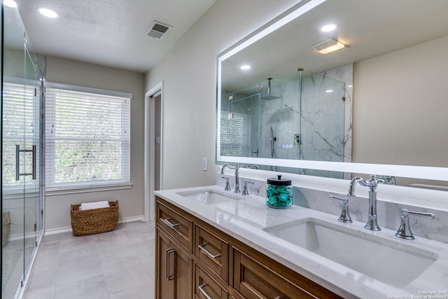 2312 Encino Xing, San Antonio, TX 78259 - bathroom with a sink, a stall shower, and visible vents