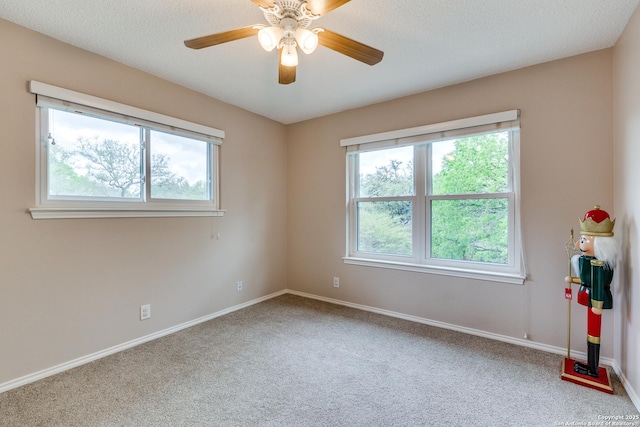 2312 Encino Xing, San Antonio, TX 78259 - spare room featuring carpet flooring, a textured ceiling, baseboards, and ceiling fan