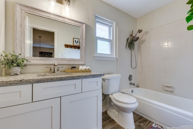 2312 Encino Xing, San Antonio, TX 78259 - full bath with washtub / shower combination, toilet, vanity, and a textured ceiling