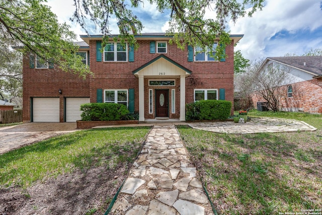 2312 Encino Xing, San Antonio, TX 78259 - view of front of house featuring fence, an attached garage, driveway, a front lawn, and brick siding