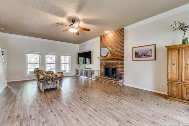 2312 Encino Xing, San Antonio, TX 78259 - living area featuring light wood-style flooring, crown molding, a textured ceiling, and ceiling fan