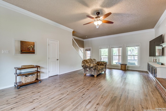 2312 Encino Xing, San Antonio, TX 78259 - sitting room with crown molding, stairs, wood finished floors, and a ceiling fan