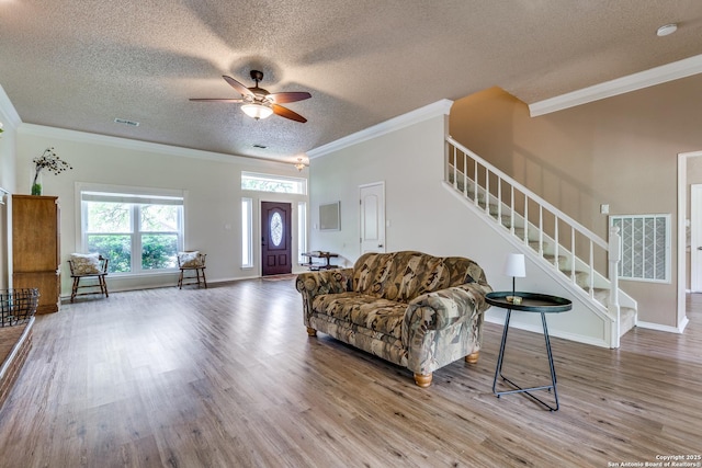 2312 Encino Xing, San Antonio, TX 78259 - living room featuring ceiling fan, wood finished floors, stairway, and crown molding