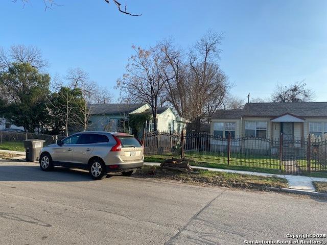 134 Elmo Ave, San Antonio, TX 78225 - ranch-style house featuring a fenced front yard and a carport