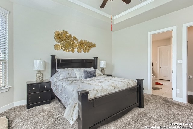 carpeted bedroom with baseboards, ornamental molding, and ceiling fan