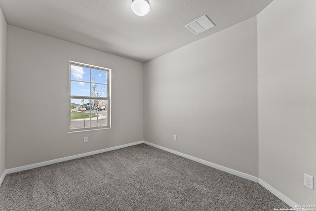 carpeted empty room with baseboards and visible vents