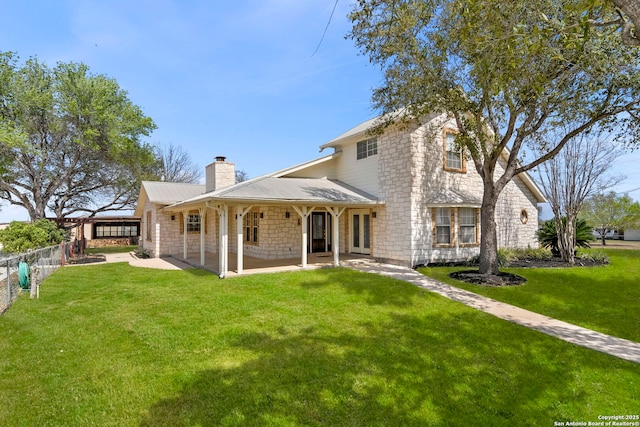 8745 Kirkner, San Antonio, TX 78263 - rear view of house featuring a patio area, a lawn, a chimney, and fence
