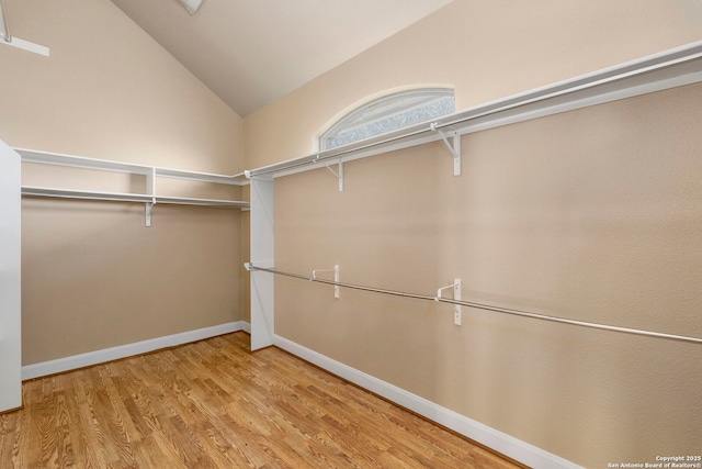 8745 Kirkner, San Antonio, TX 78263 - walk in closet featuring lofted ceiling and wood finished floors