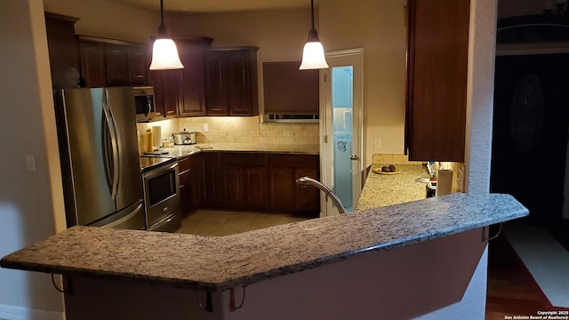 260 Campbell, Canyon Lake, TX 78133 - kitchen with a breakfast bar area, tasteful backsplash, and appliances with stainless steel finishes
