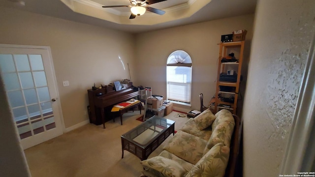 260 Campbell, Canyon Lake, TX 78133 - living room with crown molding, carpet, baseboards, a ceiling fan, and a tray ceiling