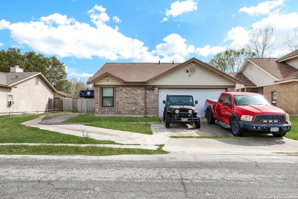 10118 Cedarvale Dr, San Antonio, TX 78245 - view of front of property with brick siding, concrete driveway, a garage, and fence