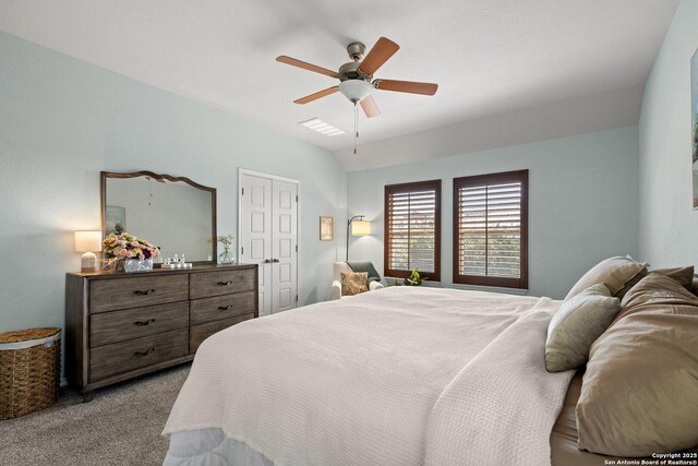 bedroom with carpet flooring, lofted ceiling, and ceiling fan