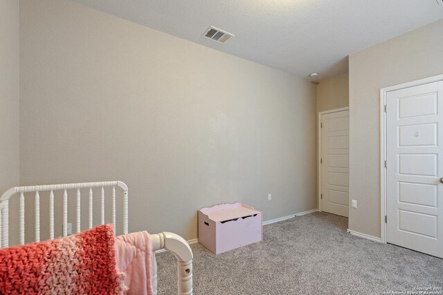 bedroom with light carpet, baseboards, and visible vents