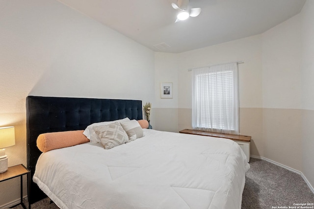 carpeted bedroom with baseboards and lofted ceiling