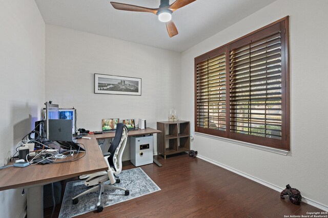 office space featuring baseboards, ceiling fan, and wood finished floors