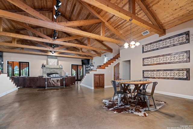 dining space featuring concrete floors, stairs, wooden ceiling, baseboards, and visible vents
