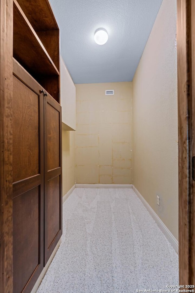 walk in closet with visible vents