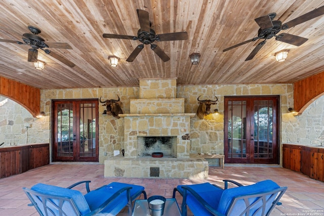 view of patio featuring french doors, a sink, and ceiling fan