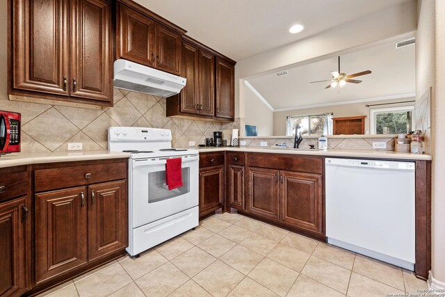 kitchen with a sink, a ceiling fan, under cabinet range hood, white appliances, and visible vents