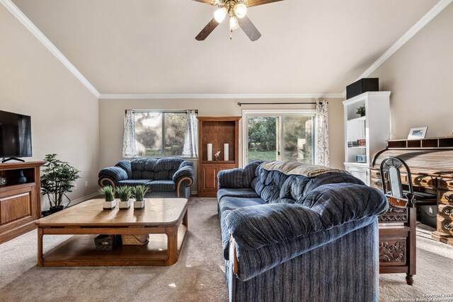 living room with light colored carpet, vaulted ceiling, crown molding, and ceiling fan