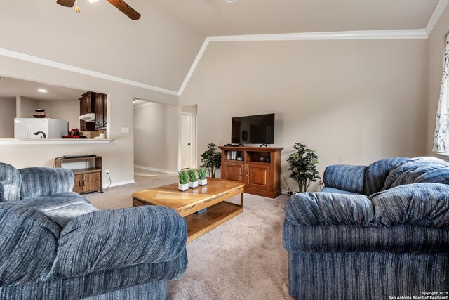 living area featuring light colored carpet, ornamental molding, high vaulted ceiling, baseboards, and a ceiling fan
